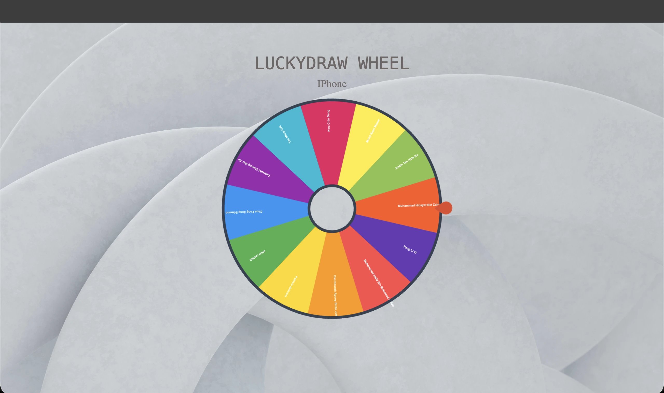 Electronic lucky draw spinning wheel displayed on screen at corporate event in Singapore