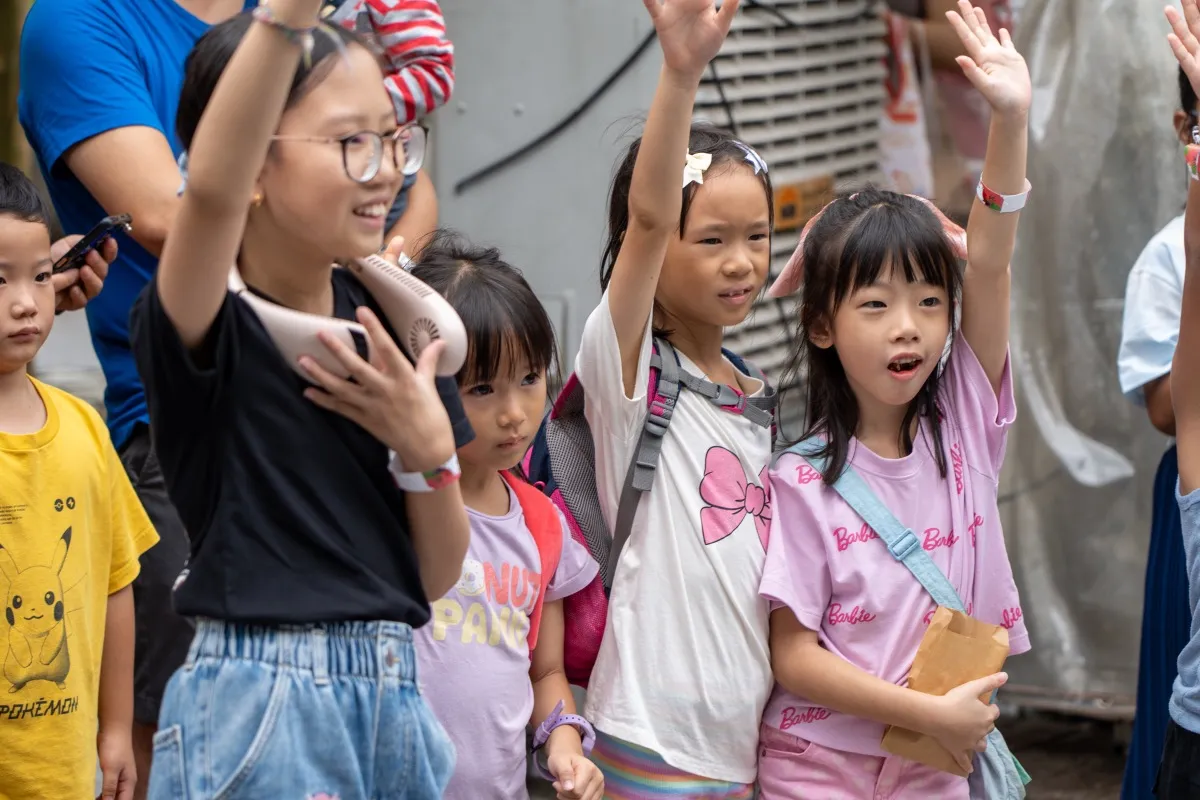 Cooking challenge team presenting dish corporate event