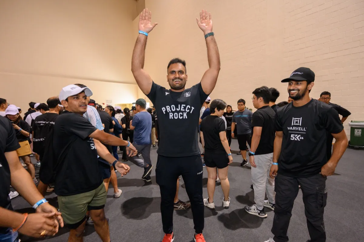 Amazing Race Singapore corporate team — group celebration after race finish